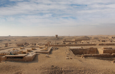 An Egyptian and camel at Pyramid Complex of Djoser at Saqqara, Egypt