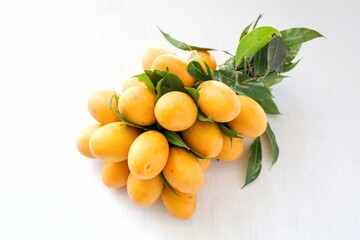 Pile of Marian Plum in white background ,Plum Mango