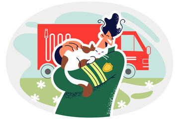 Smiling firefighter rescue cat from fire