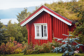 Scandinavian red house with white trim and windows