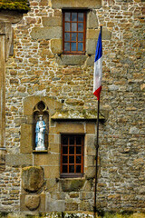 Statue of Virgin Mary and Jesus with French Flag Adorning Mont Saint Michel, Normandy, France, Europe