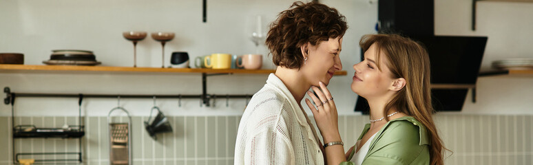 Young couple sharing a loving moment at home in a modern and cozy kitchen setting