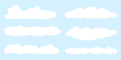 Cute doodle cloud set. White freeform clouds on blue sky background.  Fluffy and puffy cloudy shapes