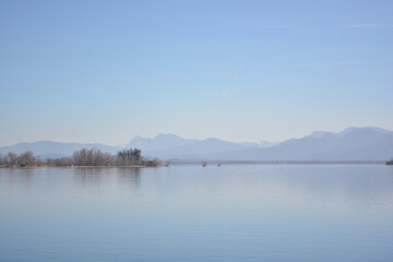 Fraueninsel, Frauenchiemsee on lake Chiemsee in the morning sunrise with boat, Sailboat, church, monastery. Bavaria, Bayern, Germany