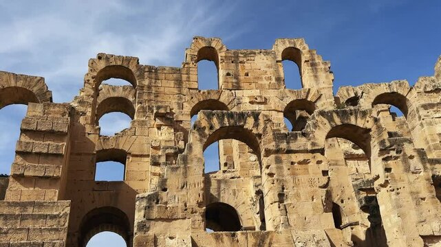 Historical Roman Colosseum Amphitheatre with Archways Against a Clear Sky