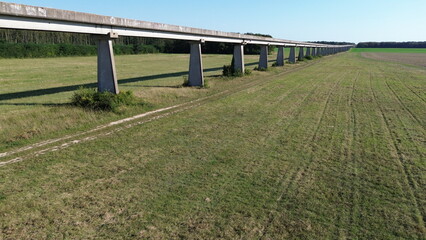 Fototapeta premium Drone picture of an experimental monorail for an experimental french aerotrain, center of France, during the 1970's, abandoned in 1977. It's around 18 km long, near Orléans, France