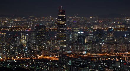 Obraz premium Night Cityscape Warm Lights Gleaming Buildings. AI Generated