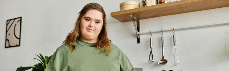 Young woman embraces her cozy home while showcasing confident flair in her kitchen
