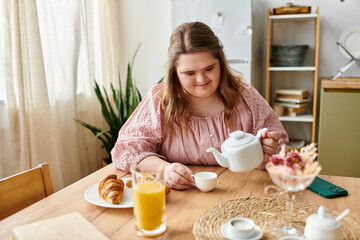 Young woman with Down syndrome enjoying tea time at home in a cozy setting with a warm atmosphere
