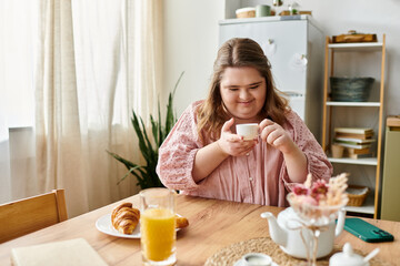 Cozy morning routine of a young woman enjoying tea at home with confidence and comfort