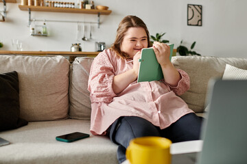 Young woman with Down syndrome enjoys cozy moments at home while writing in her notebook