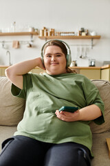 Confident young woman with Down syndrome enjoys music in a cozy home environment