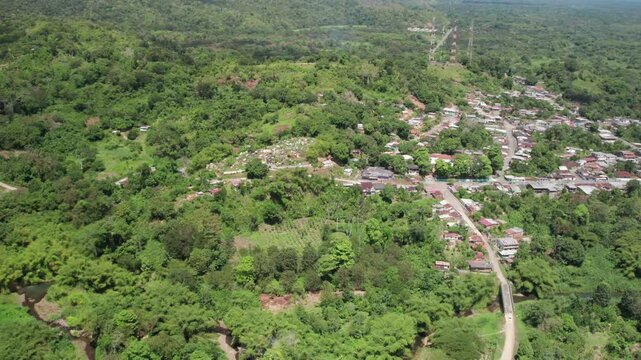 The village of el guapo in miranda, surrounded by lush greenery and hills, aerial view