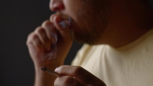 Adult male coughing after inhaling cigarette. Unhealthy smoking addiction