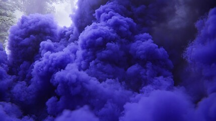 Naklejka premium Dense plumes of purple colored smoke billowing into the air