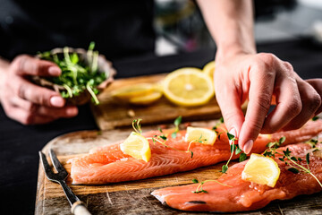 Girl decorating at fillet trout red fish