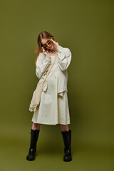 Stylish young woman showcases spring fashion with confidence and a playful attitude