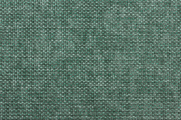Green texture of factory fabric for sewing clothes, furniture