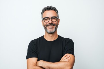 Smiling man in black t-shirt against white background