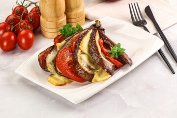 Baked tomato with mozzarella and tomato