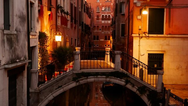 Stunning night view of one of the famous canals in Venice, Italy along with quirky buildings and powerful reflection. Venice is an archipelago of 126 islands