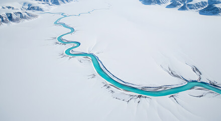 Aerial view of an turquoise glacial river snaking through a vast white snowfield