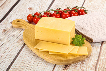 Yellow cheese piece with slices