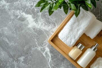 Spa Essentials Towel and Lotion Set on Marble for Relaxation
