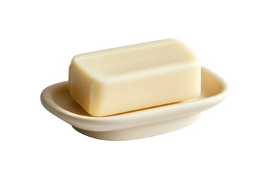 A creamy block of soap resting elegantly on a small dish, showcasing minimalist design aesthetics isolated on transparent background