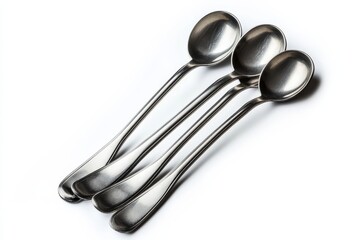 Elegant arrangement of four shiny stainless steel spoons on a white background isolated on transparent background