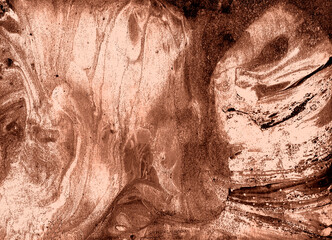 Marble. Abstract background. Different shades of Mocha Mousse and peach fuzz color. Chaotic spots and drops of different shapes. Gentle, romantic background. Brown, pastel colors.
