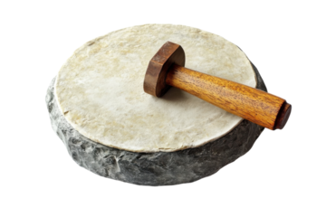 Traditional stone grinder with wooden pestle resting on a circular grinding surface isolated on transparent background