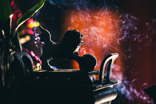 Guardian Lion (Foo Dog) Figure in a temple in Hong Kong with incense smoke, Hong Kong