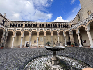 Courtyard fountain with arches and pillars of Salerno Cathedral, Salerno, Campania