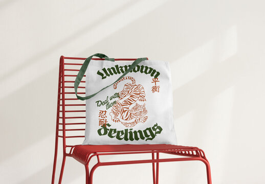 Tote Bag Mockup Displayed on a Modern Chair