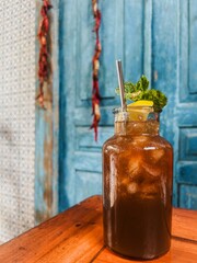 Glass of cocktail with straw
