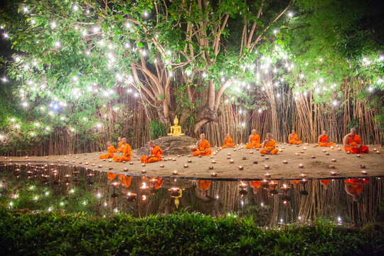 Makha Bucha (Magha Puja) celebrations, monks pray under illuminated Buddha statue annually at Wat Phan Tao temple, Chiangmai, Thailand