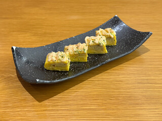 asian japanese sushi mentai cheese egg roll in long plate on wood table asian dim sum halal food...