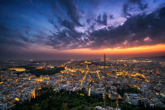 City at sunset with Parthenon and Acropolis seen from Lycabettus hill viewpoint, Athens