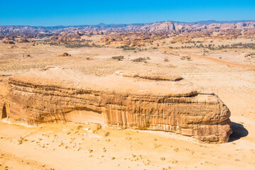 Aerial of tombs carved in sandstone rock of Jabal Banat (Qasr al-Bint), Hegra (Madain Salih), UNESCO, AlUla area, Medina Province