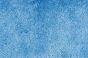 Faux fur, shiny silk velvet blue fabric or cloth macro, close up. Fluffy fabric texture of...