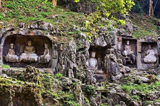 Ancient carvings of arhats, Bodhisattvas and Buddhas on hillside of Feilaifeng (Flying Peak), Lingyin Temple, Hangzhou, Zhejiang Province