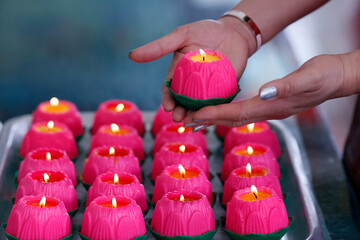 Pink lotus flower candles symbolising human growth and development, at the Thean Hou Temple, Kuala Lumpur, Malaysia