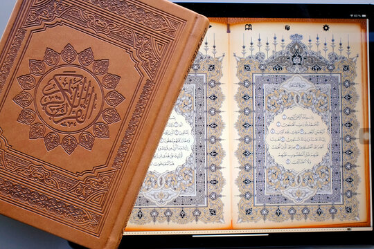 Religious Islamic text, The Quran, over 6000 verses in 114 capters called Surahs, paper and digital Quran