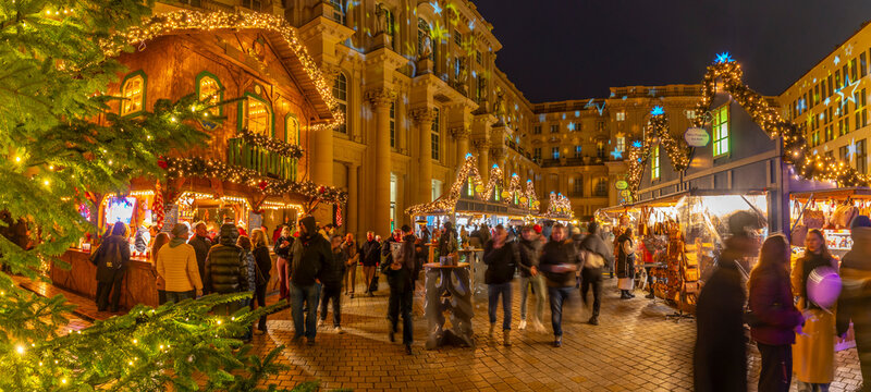 Christmas market stalls in Schluterhof des Berliner Schlosses at dusk, Mitte, Berlin, Germany