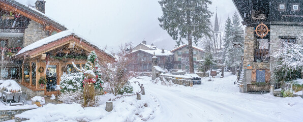 View of snow covered wooden houses in Entreves in winter, Entreves, Aosta Valley, Italian Alps