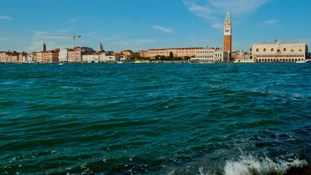 Establishing shot of Venice, Italy, revealing the Bridge of Sighs, Palazzo Ducale (Doge's Palace), Piazza San Marco (St Mark's Square) and the famous gondolas