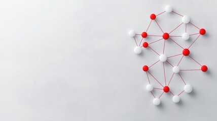 Abstract molecular model with red and white spheres connected by lines on a light background.