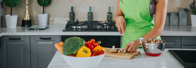 Healthy living and food concept. Woman in a kitchen details. 