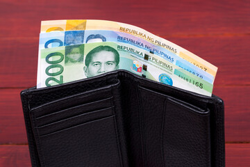 Philippine peso in the black wallet